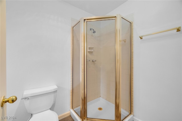 bathroom with toilet and walk in shower