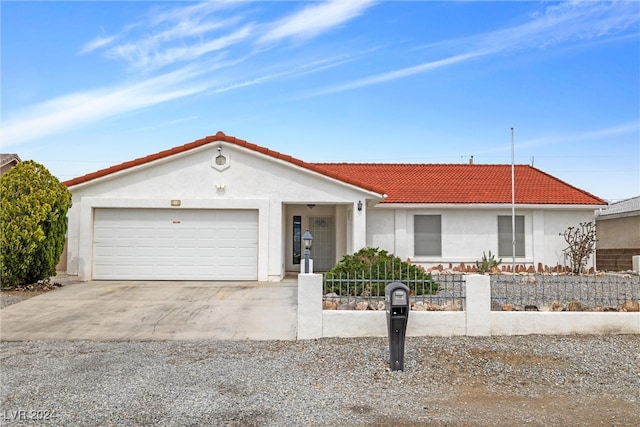 ranch-style house featuring a garage