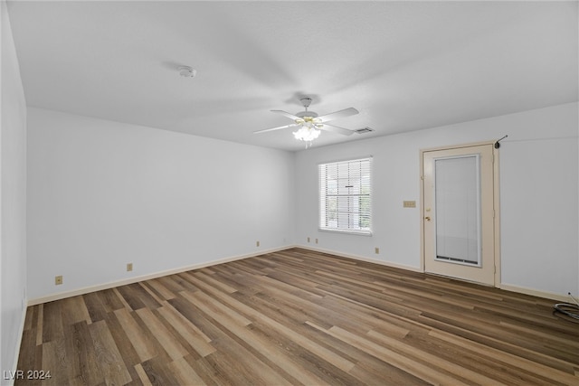 spare room with wood-type flooring and ceiling fan