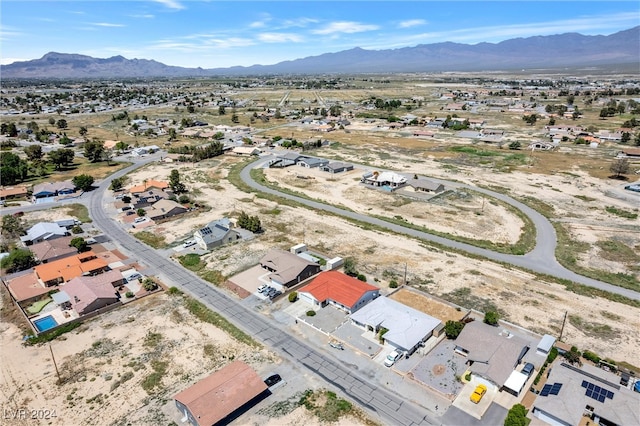 birds eye view of property with a mountain view