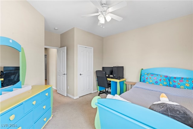 bedroom featuring ceiling fan and light colored carpet