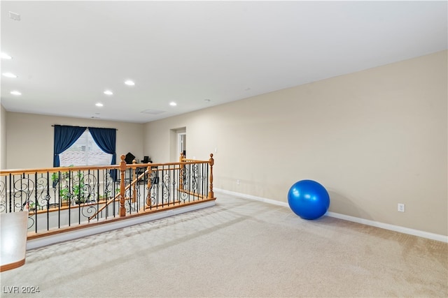 exercise room with carpet flooring