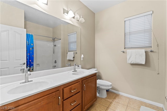 full bathroom with tile patterned floors, vanity, shower / tub combo, and toilet