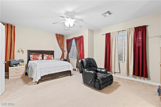 bedroom with light colored carpet and ceiling fan