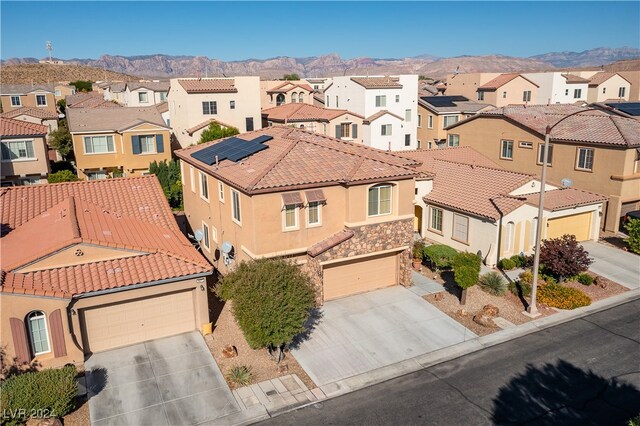 birds eye view of property with a mountain view