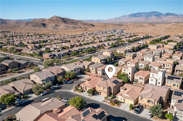 birds eye view of property with a mountain view