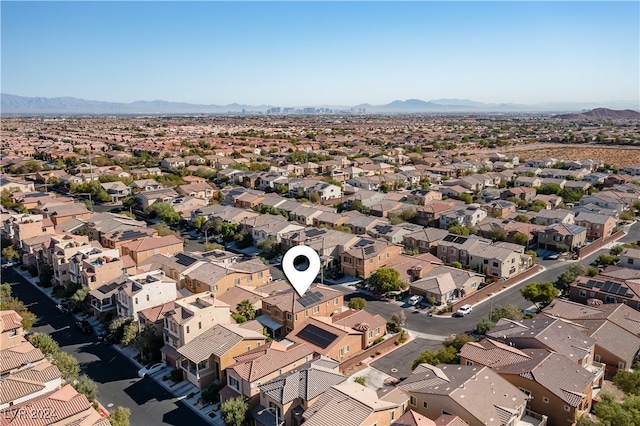 birds eye view of property with a mountain view