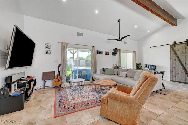 living area featuring a barn door, visible vents, ceiling fan, beamed ceiling, and high vaulted ceiling