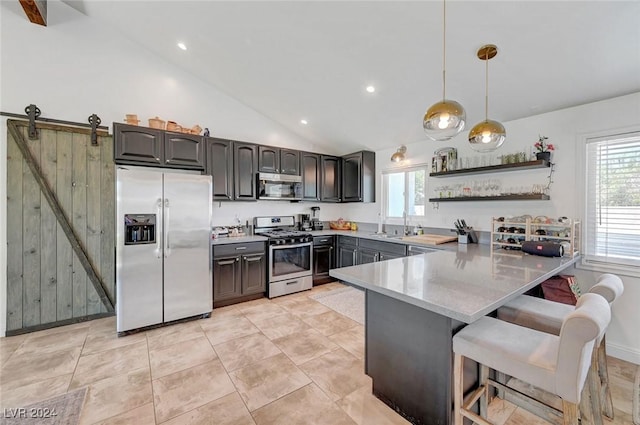 kitchen with decorative light fixtures, a breakfast bar area, open shelves, light countertops, and appliances with stainless steel finishes