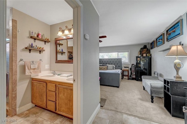 ensuite bathroom featuring double vanity, tile patterned flooring, ensuite bath, and a sink