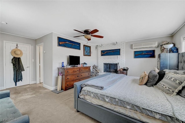 bedroom featuring ceiling fan, a wall unit AC, light colored carpet, a fireplace, and baseboards