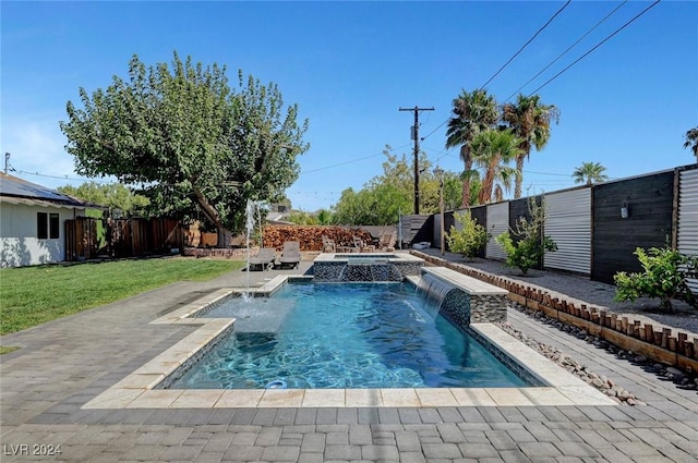 view of swimming pool with a patio, a lawn, a fenced backyard, and a pool with connected hot tub