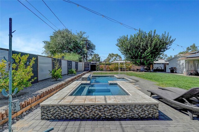 view of swimming pool featuring a fenced backyard, a fenced in pool, a patio, and an in ground hot tub