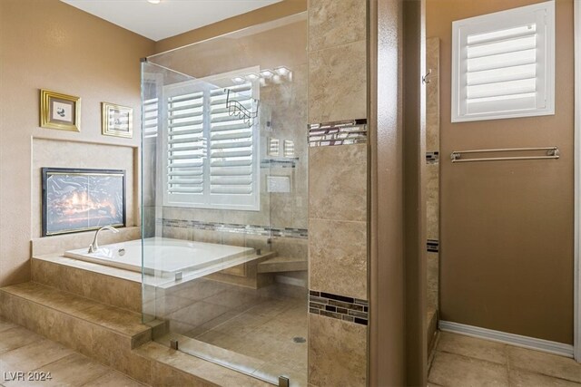 bathroom featuring separate shower and tub and tile patterned floors