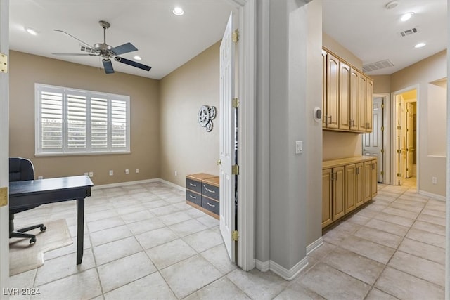 tiled home office with ceiling fan