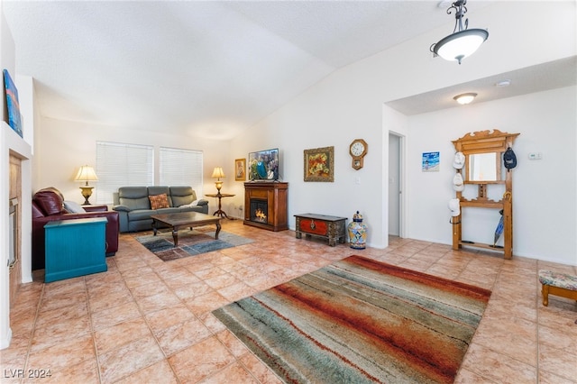 tiled living room with vaulted ceiling