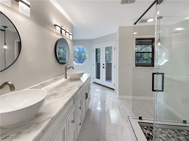 bathroom with vanity, french doors, and walk in shower