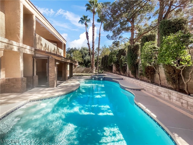 view of pool featuring a patio