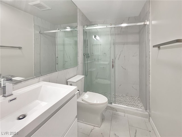 bathroom with vanity, toilet, and an enclosed shower