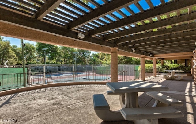 view of patio with a pergola and a community pool