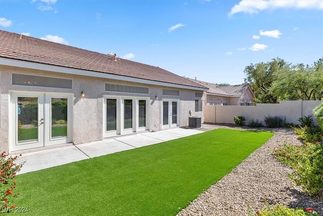 back of house with a patio area, french doors, fence, and stucco siding