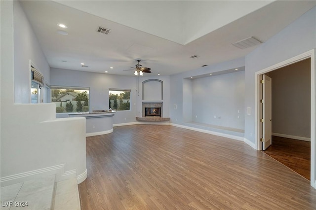 7421 Silver Palm Ave, Las Vegas, NV 89117 - unfurnished living room featuring visible vents, a ceiling fan, and wood finished floors
