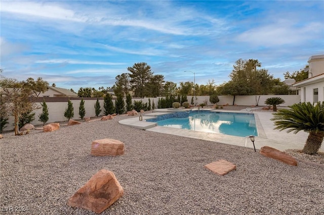 7421 Silver Palm Ave, Las Vegas, NV 89117 - view of swimming pool featuring a patio, a fenced in pool, and a fenced backyard