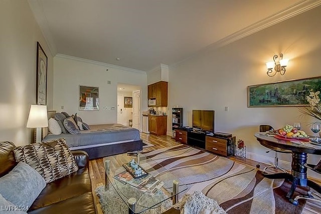 bedroom with crown molding and hardwood / wood-style floors