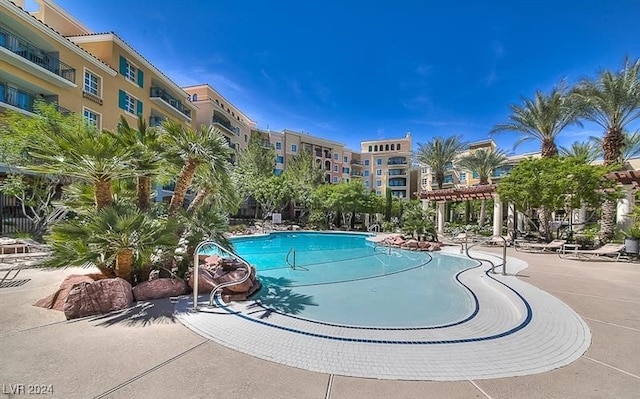 view of swimming pool featuring a pergola