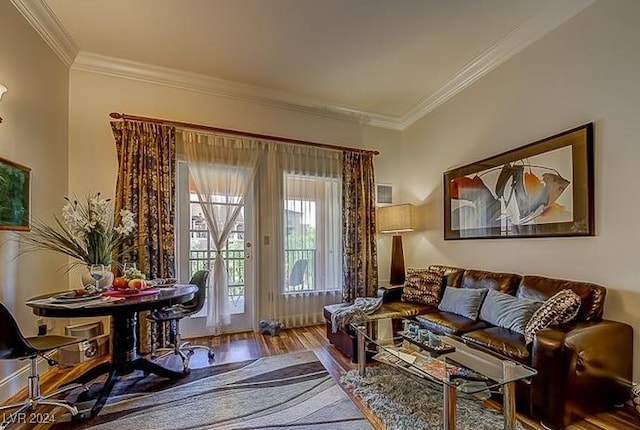 sitting room featuring ornamental molding and hardwood / wood-style floors