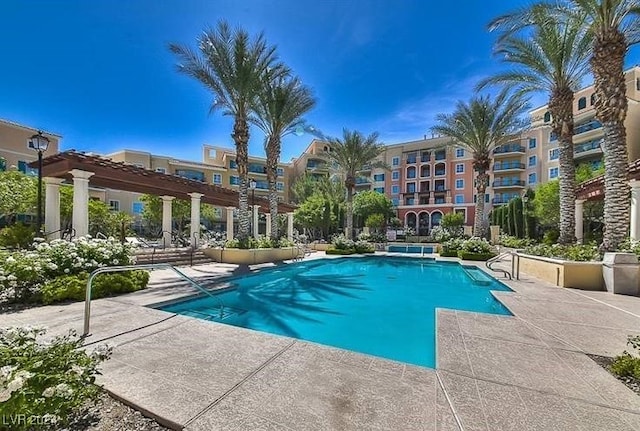 view of pool with a pergola and a patio area