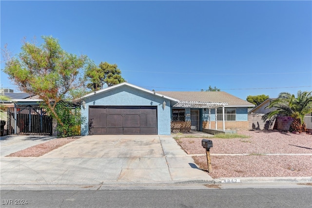 ranch-style home featuring a garage