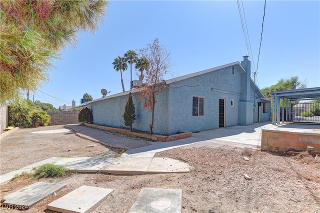 4842 E Imperial Ave, Las Vegas, NV 89104 - back of property with a patio area, a fenced backyard, and stucco siding