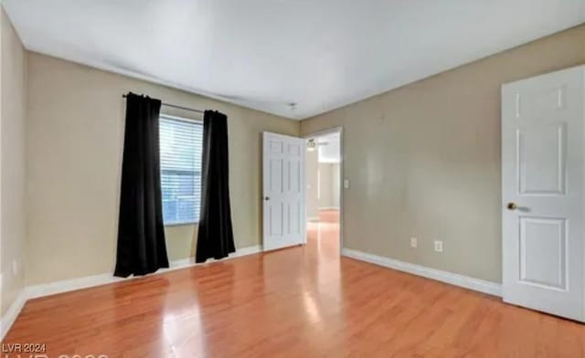 empty room featuring wood-type flooring