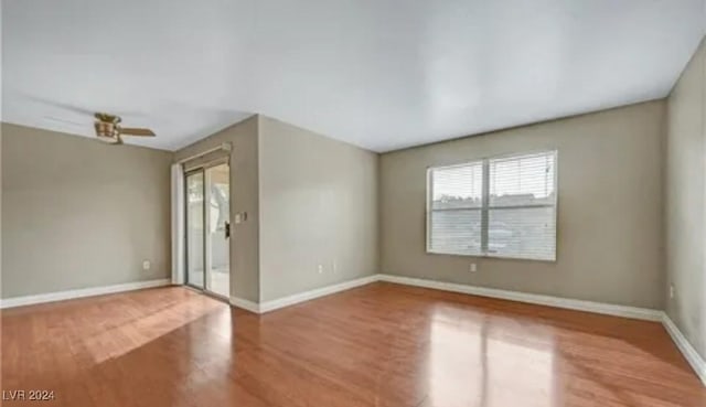 unfurnished room with hardwood / wood-style floors