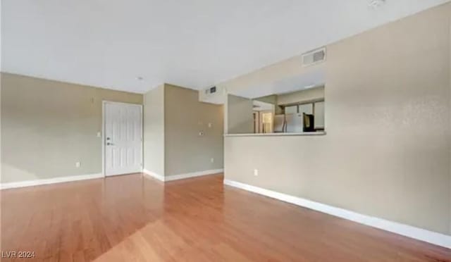 unfurnished room featuring hardwood / wood-style floors