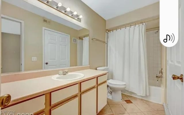 full bathroom featuring shower / bath combination with curtain, tile patterned floors, toilet, and vanity