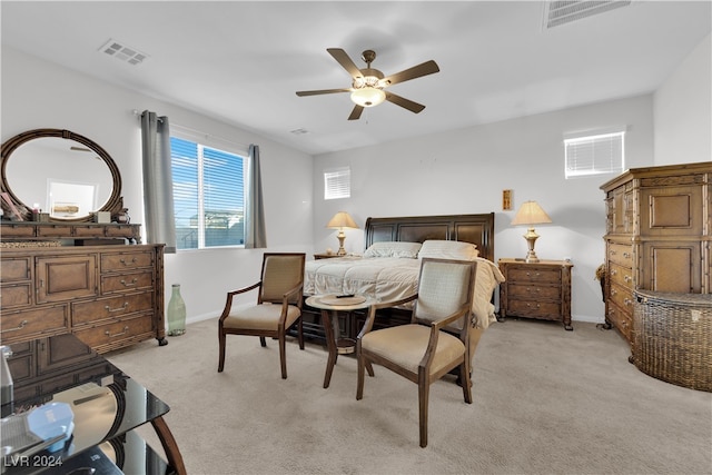 bedroom with light carpet and ceiling fan