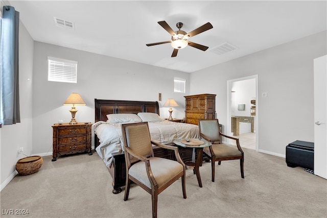 carpeted bedroom featuring ceiling fan and ensuite bathroom