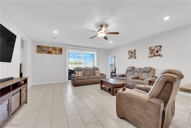 tiled living room with ceiling fan