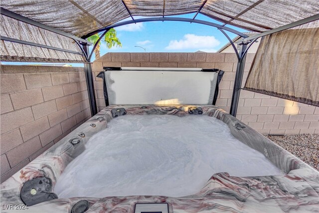 exterior space featuring a jacuzzi