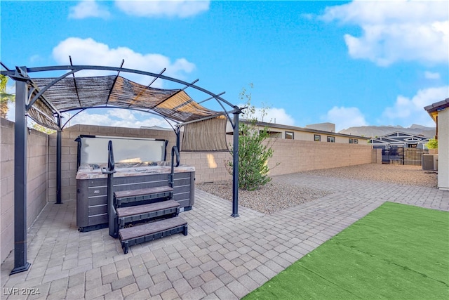 view of patio / terrace featuring a hot tub and central air condition unit