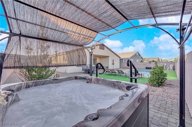 view of patio featuring a hot tub