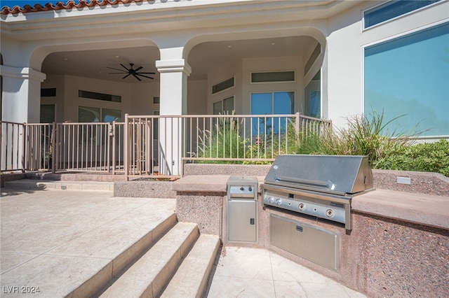 view of patio / terrace with area for grilling, ceiling fan, and grilling area