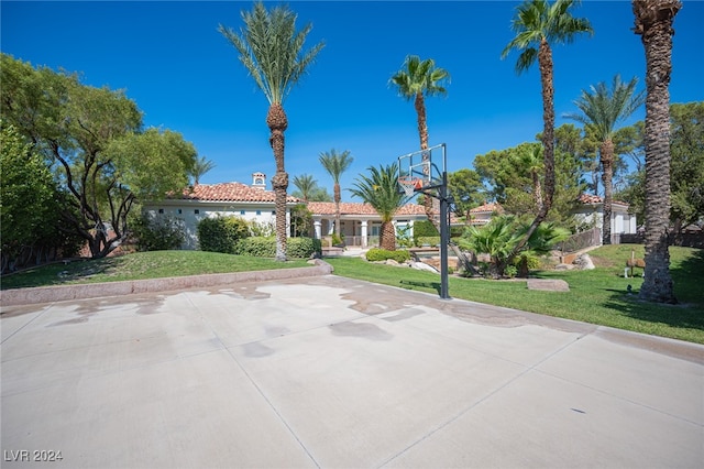 mediterranean / spanish-style home featuring a front yard