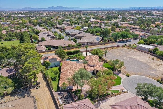 birds eye view of property featuring a mountain view