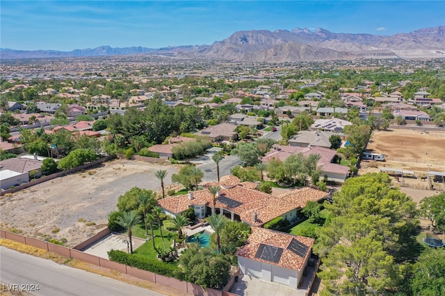 birds eye view of property with a mountain view