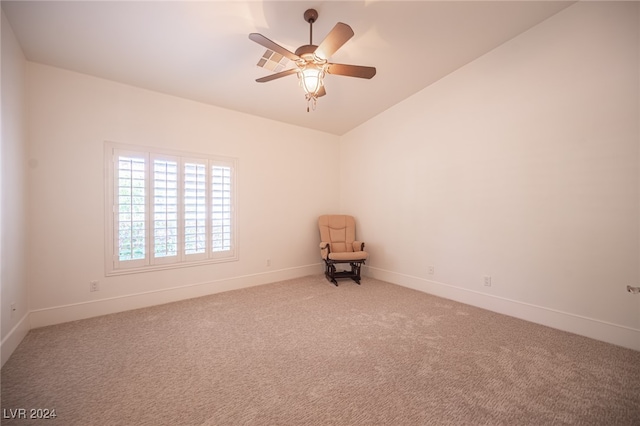 carpeted empty room with lofted ceiling and ceiling fan