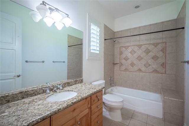 full bathroom featuring vanity, tiled shower / bath combo, toilet, and tile patterned flooring