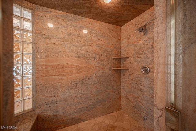 bathroom featuring tiled shower